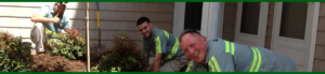 Greener Horizon Employees smiling and landscaping