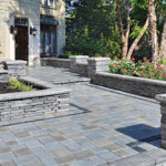 Hardscaping: Front-Entry with stone walkways and half walls - Greener Horizon