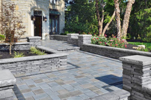 Hardscaping: Front-Entry with stone walkways and half walls - Greener Horizon