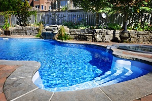 Swimming Pool With Waterfall and Patio