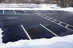 Empty parking lot with snow removed.