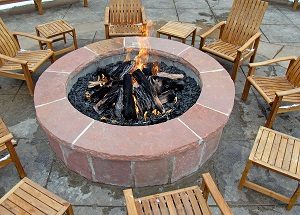 Should I Install an Outdoor Fireplace or Firepit - JT Landscaping